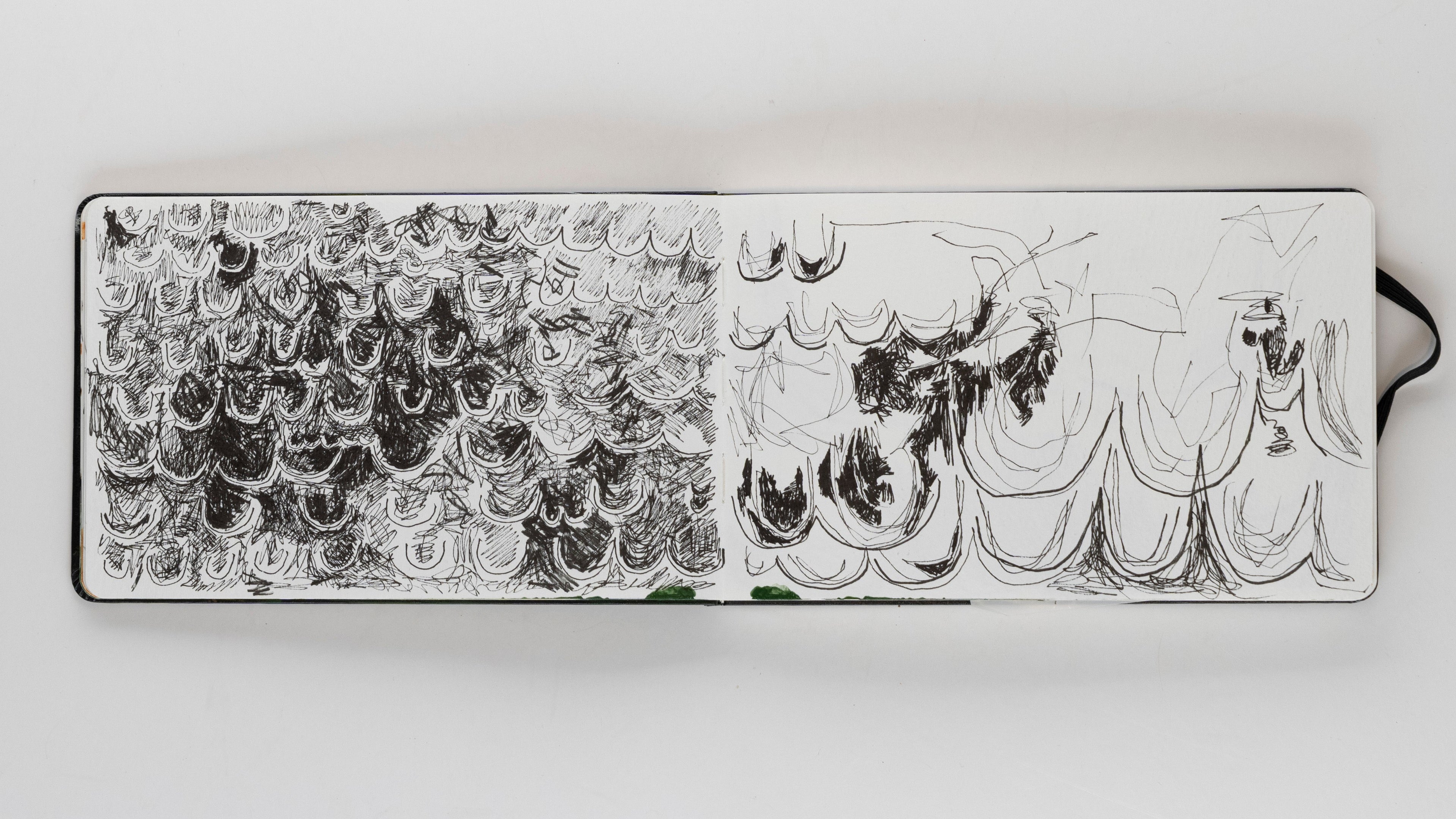 sketch book showing abstract ink sketches